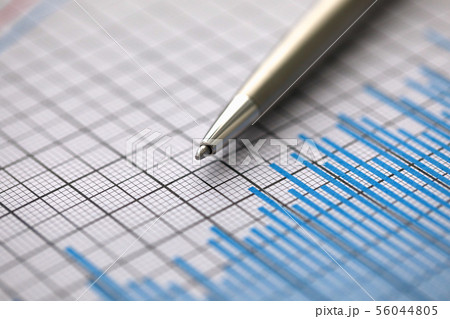 Silver pen lies on paper documents with color 56044805