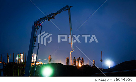 Construction crane truck working on structure at 56044956