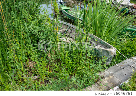 Hidden abandoned boat, Ioannina island, Greece Hidden abandoned boat, Ioannina island, Greece 56046761