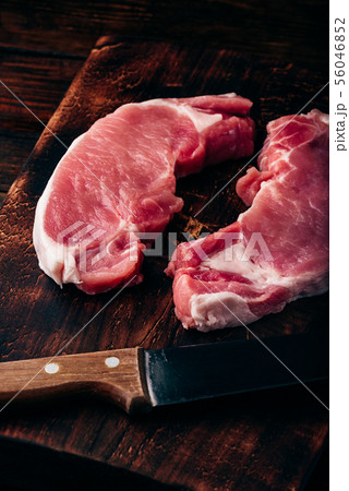 Two pork loin steaks with knife Two pork loin steaks with knife 56046852
