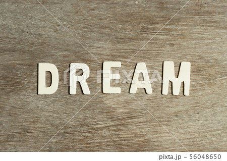 Alphabet letter in word dream on wood background 56048650