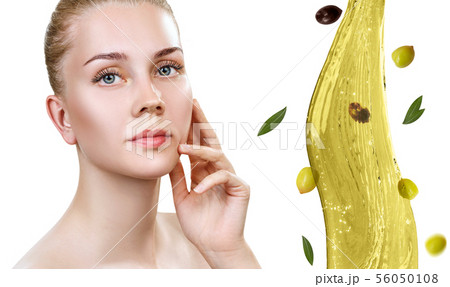 Young beautiful woman near splash of olive oil. Young beautiful woman near splash of olive oil. 56050108