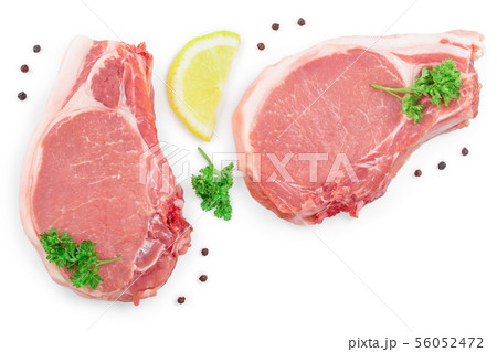 sliced raw pork meat with parsley and lemon isolated on white background with copy space for your 56052472