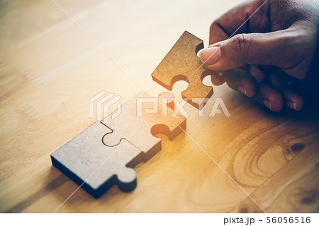 Business people are taking puzzles to connect. Business people are taking puzzles to connect. 56056516