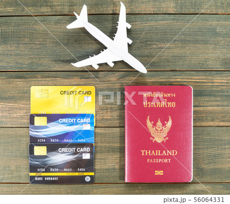 Passport with  credit card on brown wooden 56064331