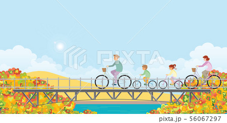 Family are riding on bicycles on bridge in autumn. 56067297