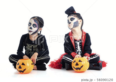 children trick or treating on white background 56090120