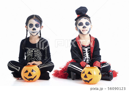 children trick or treating on white background 56090123