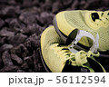 Sport watch for triathlon on yellow running shoes 56112594