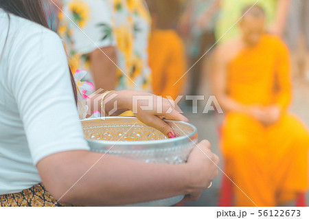 People are holding a bowl of water perfume  56122673
