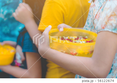 People are holding a bowl of water perfume  56122674