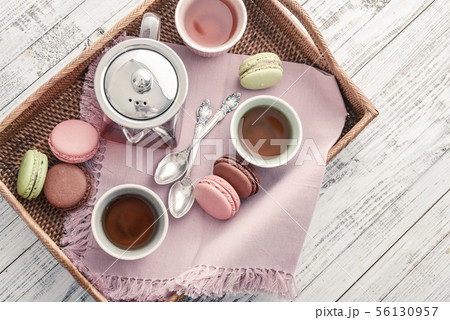Different kinds of macaroons with glass teapot 56130957