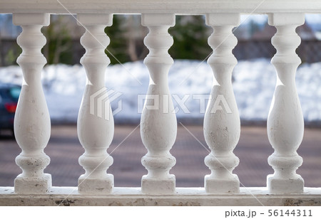White balusters in a row, classic handrails 56144311