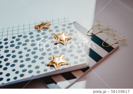 Desktop feminine composition. Notepads and stars Desktop feminine composition. Notepads and stars 56159617