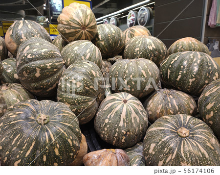 Pile of ripe pumpkin for sale  56174106