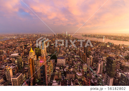 New York City skyline with Manhattan skyscrapers at dramatic stormy sunset, USA. New York City skyline with Manhattan skyscrapers at dramatic stormy sunset, USA. 56182802
