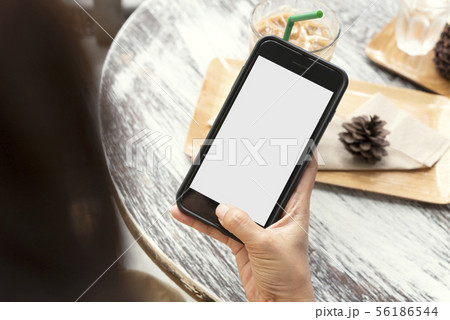 Mockup image of hands holding and using mobile Mockup image of hands holding and using mobile 56186544