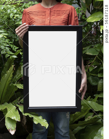 Hand Holding Blank Photo Frame for Design Mockup Hand Holding Blank Photo Frame for Design Mockup 56187118