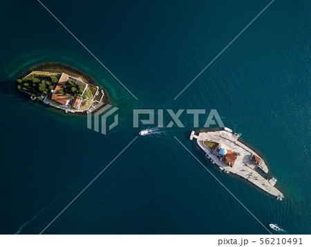 Aerial photo of St. George and monastery on the islands near Perast town in Kotor bay Aerial photo of St. George and monastery on the islands near Perast town in Kotor bay 56210491