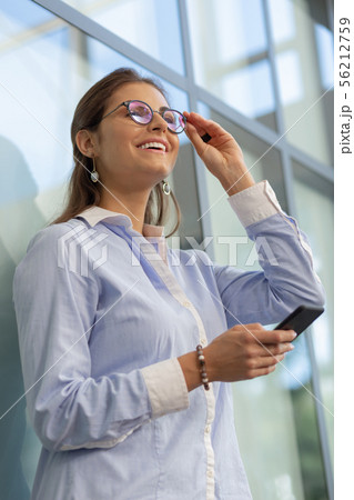 Positive delighted young female laughing at joke Positive delighted young female laughing at joke 56212759