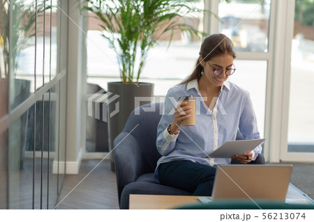 Cute young businesswoman preparing for business meeting 56213074
