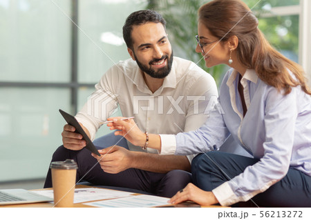 Handsome bearded male person looking at his partner Handsome bearded male person looking at his partner 56213272
