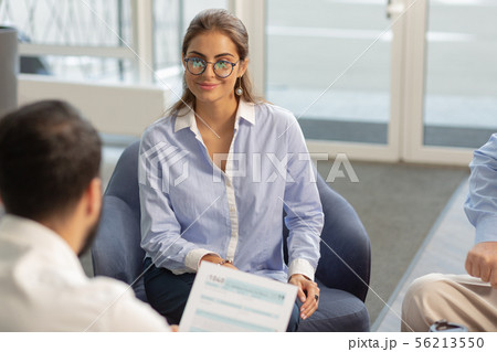 Charming young office worker being in all ears Charming young office worker being in all ears 56213550