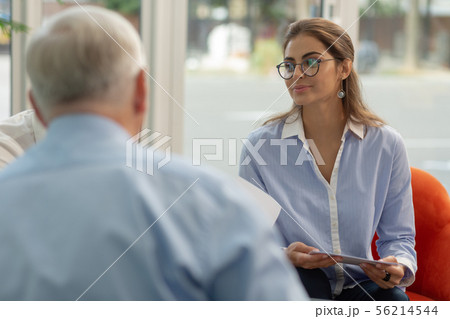 Cute young woman being on business meeting Cute young woman being on business meeting 56214544
