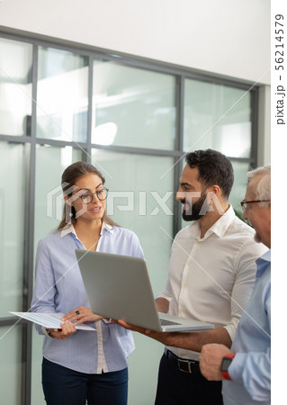 Charming female person talking to her colleagues 56214579