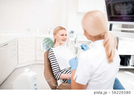 Patient being confused sitting at dentists office. Patient being confused sitting at dentists office. 56220380