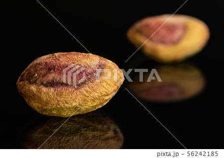 Green salted pistachio isolated on black glass Green salted pistachio isolated on black glass 56242185