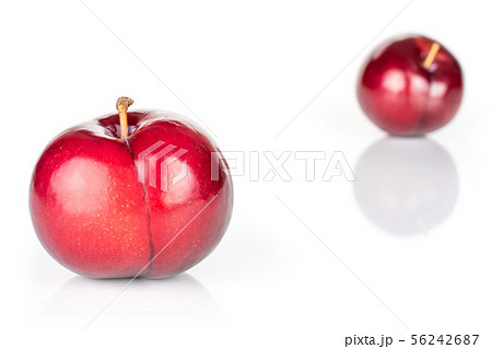 Ripe red plum isolated on white Ripe red plum isolated on white 56242687
