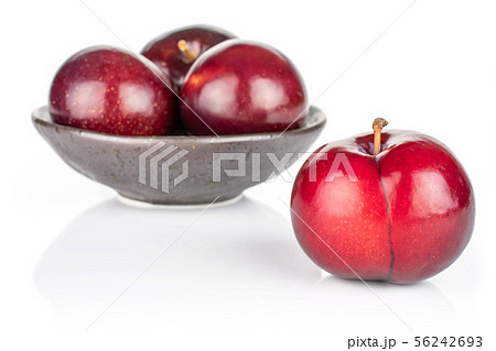 Ripe red plum isolated on white 56242693