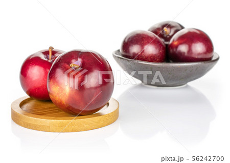 Ripe red plum isolated on white Ripe red plum isolated on white 56242700
