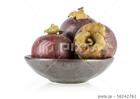Deep purple mangosteen isolated on white Deep purple mangosteen isolated on white 56242762