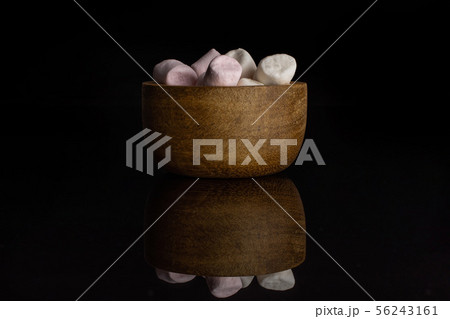 Sweet fluffy marshmallow isolated on black glass Sweet fluffy marshmallow isolated on black glass 56243161