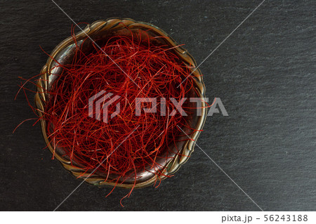 Red chili threads on grey stone Red chili threads on grey stone 56243188