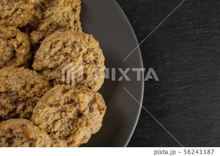 Oat crumble biscuit on grey stone Oat crumble biscuit on grey stone 56243387