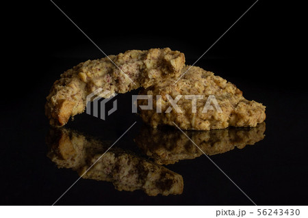 Oat crumble biscuit isolated on black glass Oat crumble biscuit isolated on black glass 56243430