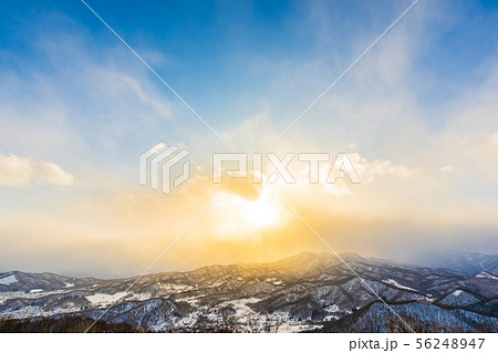 Beautiful landscape with mountain around tree in snow winter season at sunset time Beautiful landscape with mountain around tree in snow winter season at sunset time 56248947