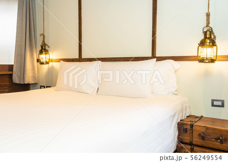 Beautiful comfortable white pillow and blanket on bed decoration in bedroom Beautiful comfortable white pillow and blanket on bed decoration in bedroom 56249554