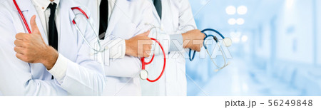 Doctor working in hospital with other doctors. Doctor working in hospital with other doctors. 56249848