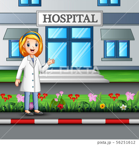 A nurse standing in front of hospital building 56251612