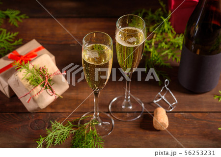 Christmas holiday table with glasses and a bottle 56253231