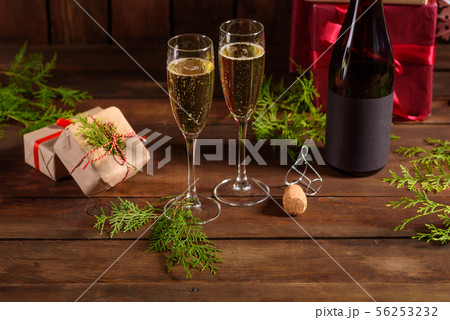 Christmas holiday table with glasses and a bottle 56253232