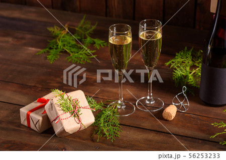 Christmas holiday table with glasses and a bottle 56253233