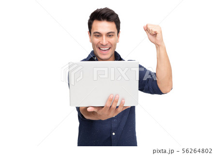 Portrait of an excited man holding laptop computer Portrait of an excited man holding laptop computer 56264802
