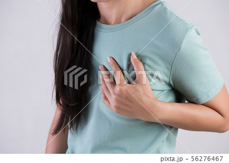 Closeup woman having heart attack. Closeup woman having heart attack. 56276467