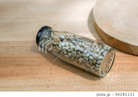 coffee beans in the bottle on wood table coffee beans in the bottle on wood table 56281131