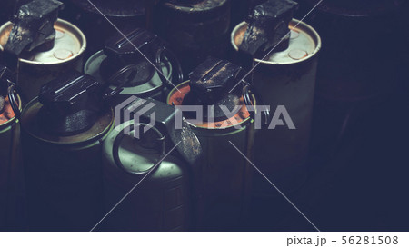 old hand grenades in box with dark background old hand grenades in box with dark background 56281508